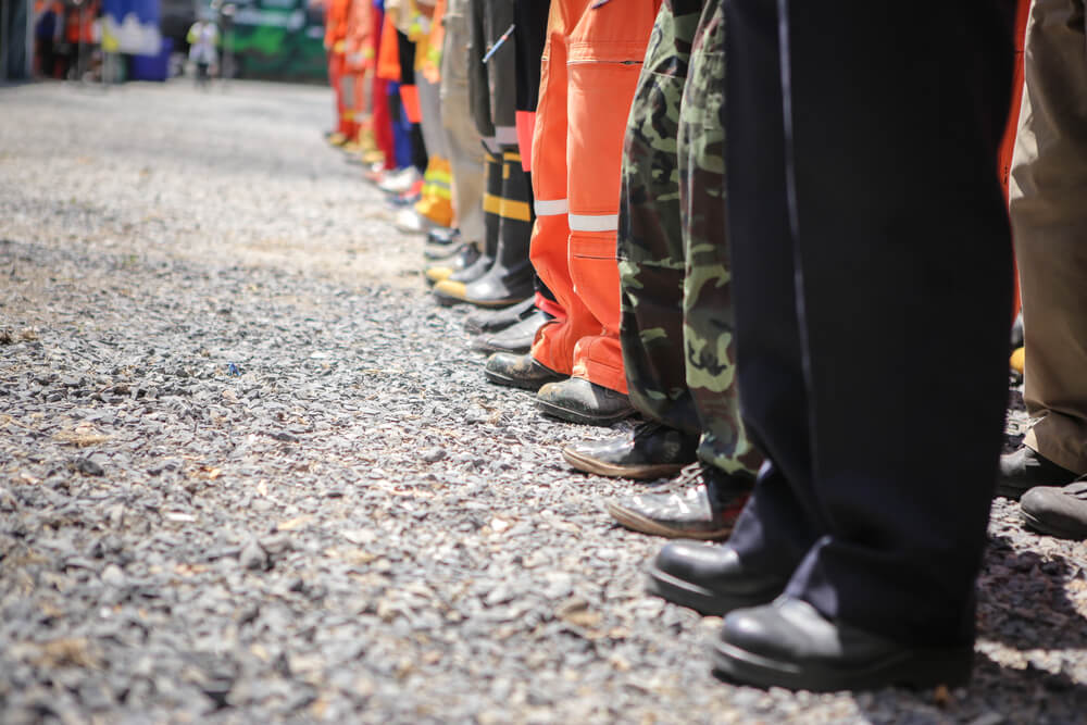 Emergency response team in protective clothing, all in a line